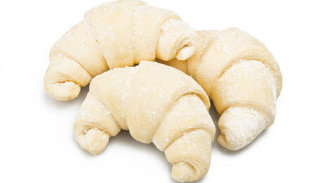 Frozen brioches ready to oven on the white